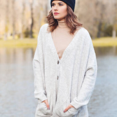 Autumn woman in black cap outdoors in fall park